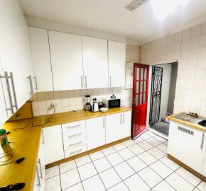 Secure 2 bedroom home with income-generating cottage