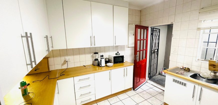Secure 2 bedroom home with income-generating cottage