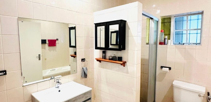 Secure 2 bedroom home with income-generating cottage