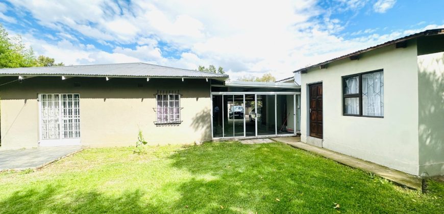 Secure 2 bedroom home with income-generating cottage
