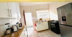 Secure 2 bedroom home with income-generating cottage