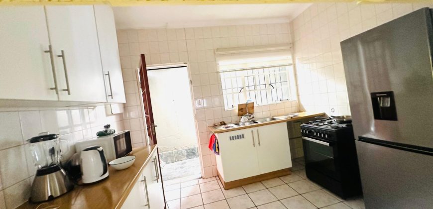Secure 2 bedroom home with income-generating cottage