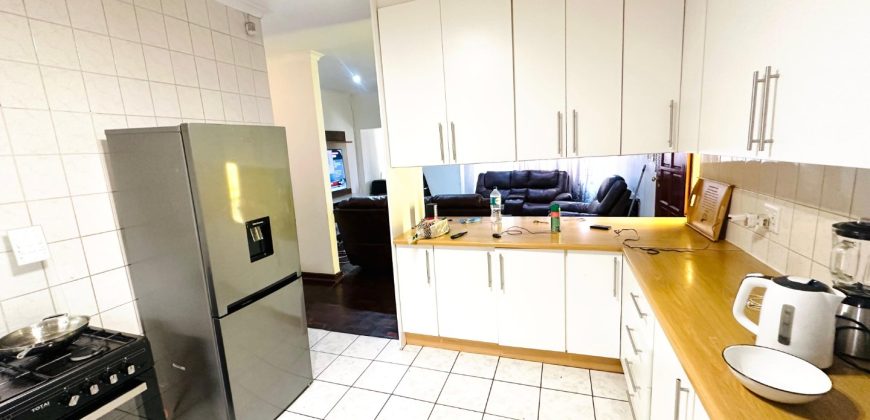 Secure 2 bedroom home with income-generating cottage