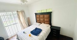 Secure 2 bedroom home with income-generating cottage