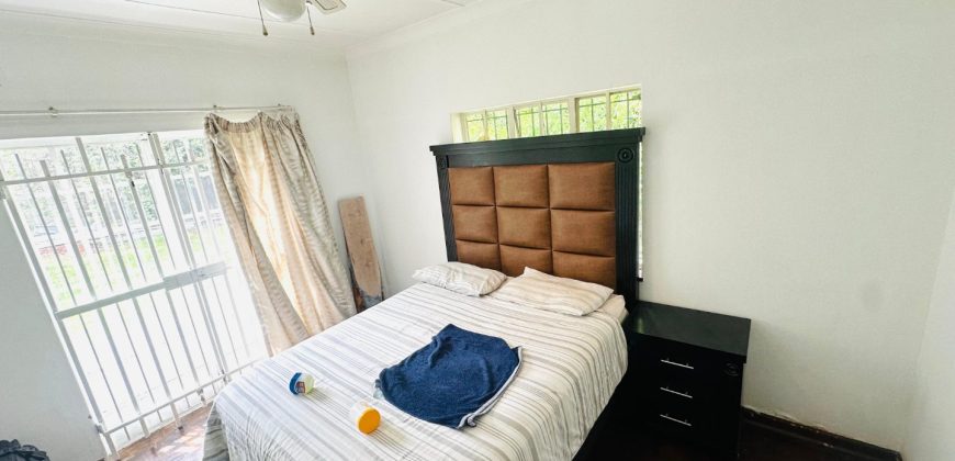 Secure 2 bedroom home with income-generating cottage