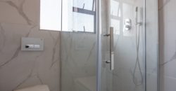 Modern 2-bedroom townhouse with private yard & double garage