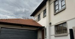 Modern 2-bedroom townhouse with private yard & double garage
