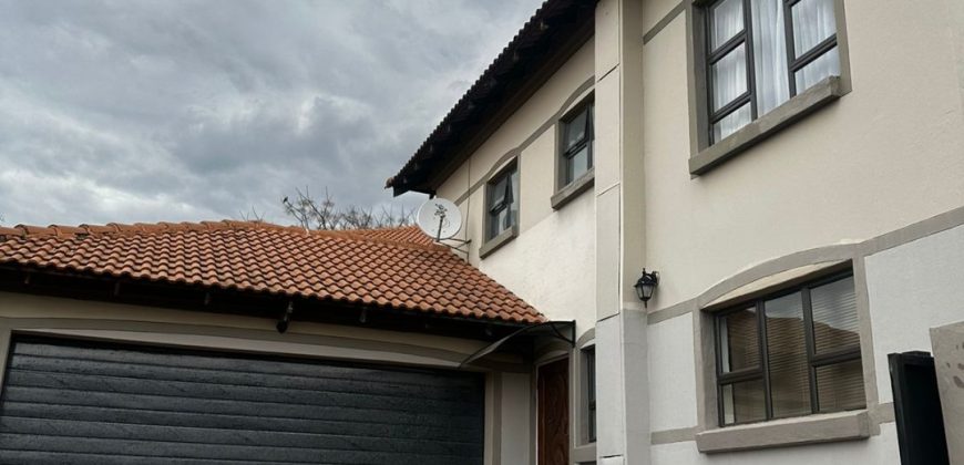 Modern 2-bedroom townhouse with private yard & double garage