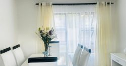 Modern 2-bedroom townhouse with private yard & double garage