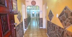 Guest house with multiple rooms, shops and entertainment area!