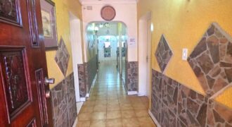Guest house with multiple rooms, shops and entertainment area!